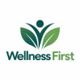 Wellness First logo featuring a green leaf and human figure icon above the brand name on a white background.